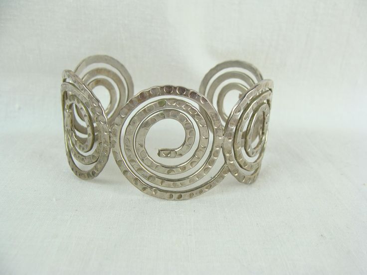Bold chunky silver bracelet and rings with metallic finish trending in 2025